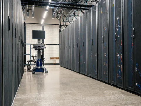 An aisle between server cabinets