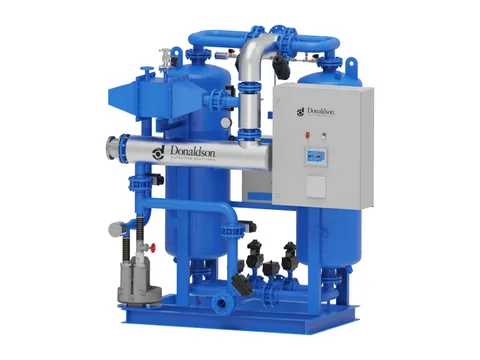 A large twin-tower heated desiccant dryer on a skid, with its heater and control panel